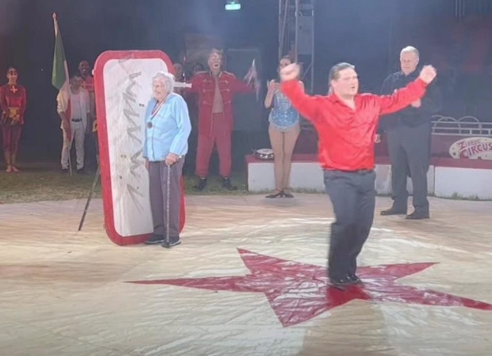 A 99-year-old woman realized her dream of having knives thrown at her in the circus.