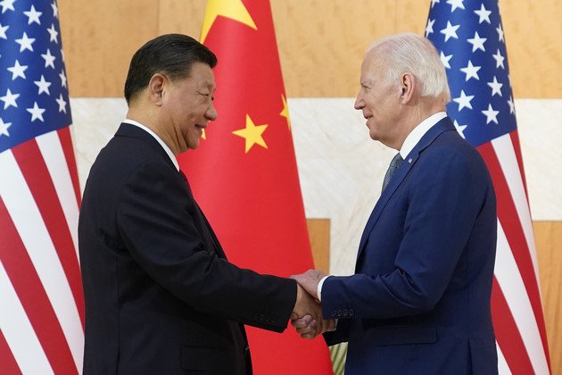 Biden and Xi shake hands in Bali in an effort to defuse US-China tensions