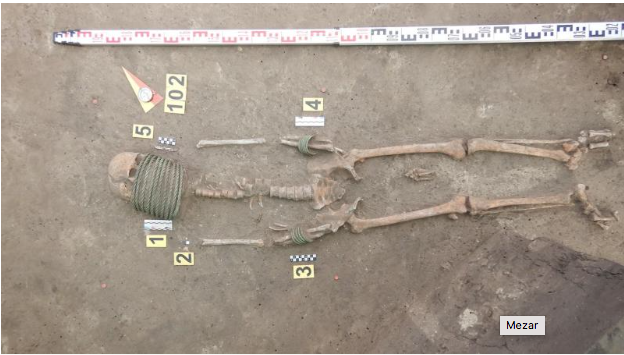Skeletons with rings around their necks found in thousand-year-old tomb 1